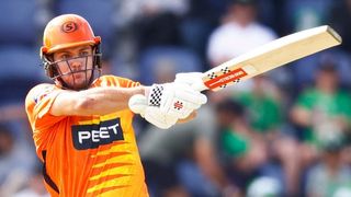 Aaron Hardie, wearing bright orange kit, orange helmet and white gloves, swings a cricket bat ahead of the start of the 2023 Big Bash League live stream